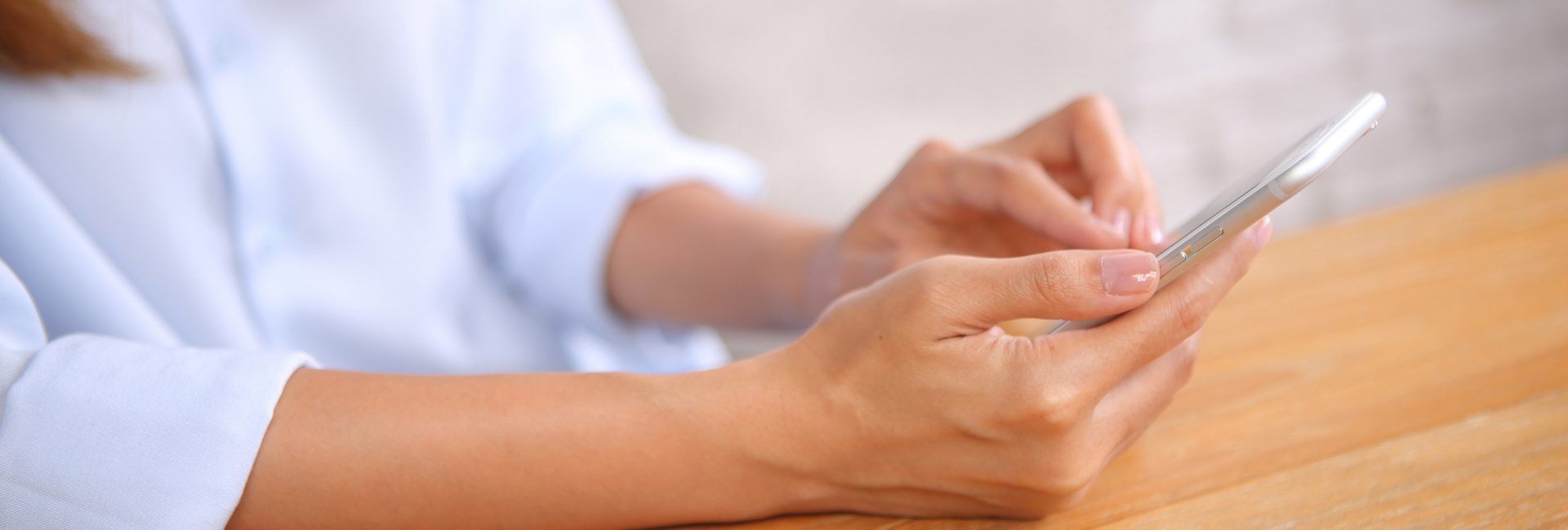 lady's hands using a mobile