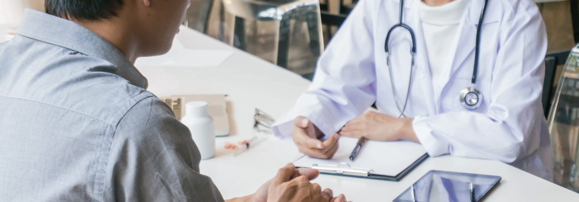 Doctor talking to a patient at a desk