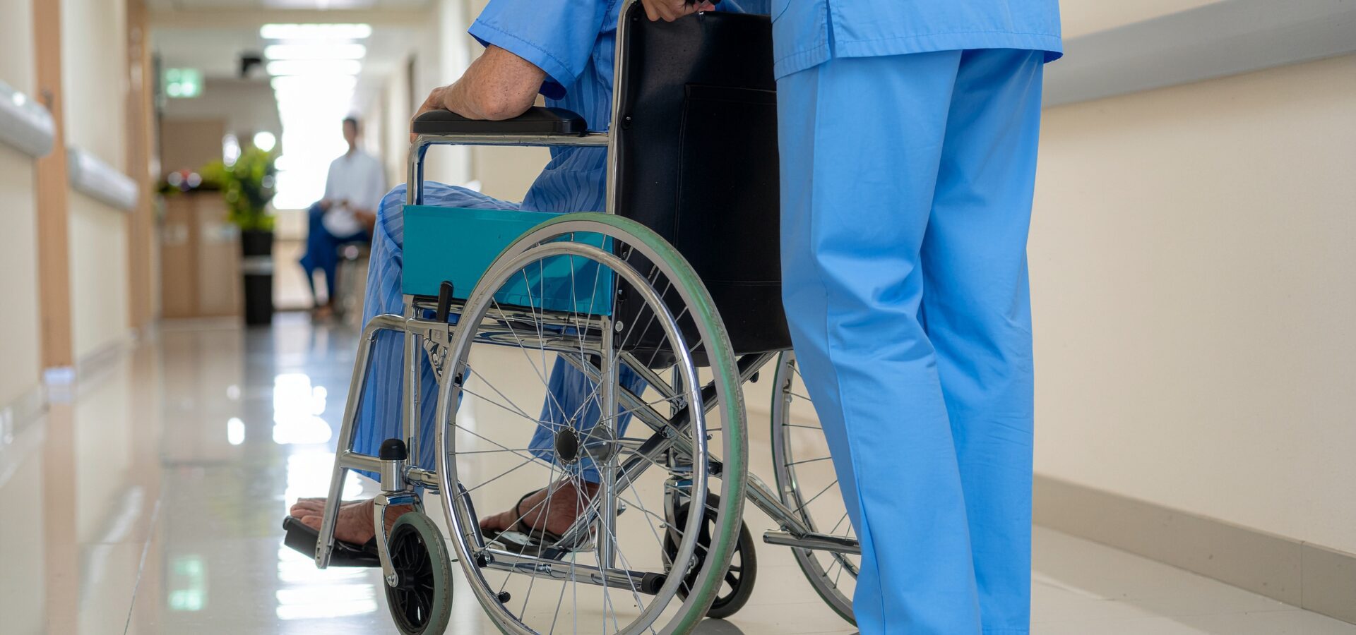 Nurse pushing wheelchair