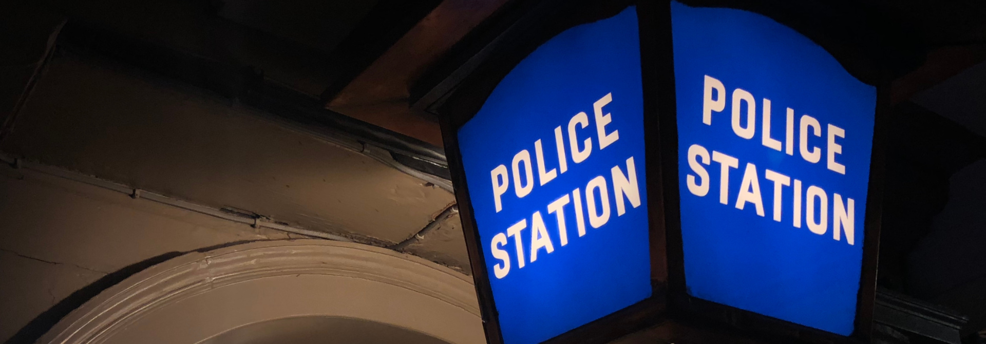 Blue lantern exterior police sign